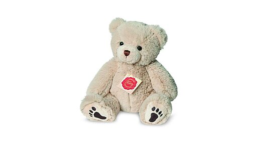 10192 Teddy, beige Sitzender Plüschtierteddy in wollweiß mit braunen aufgestickten Tatzen.