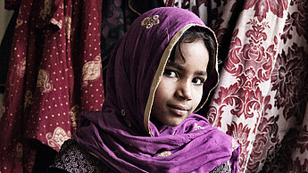 Adolescent girl at her home in Sixty-Six Quarters, Islamabad