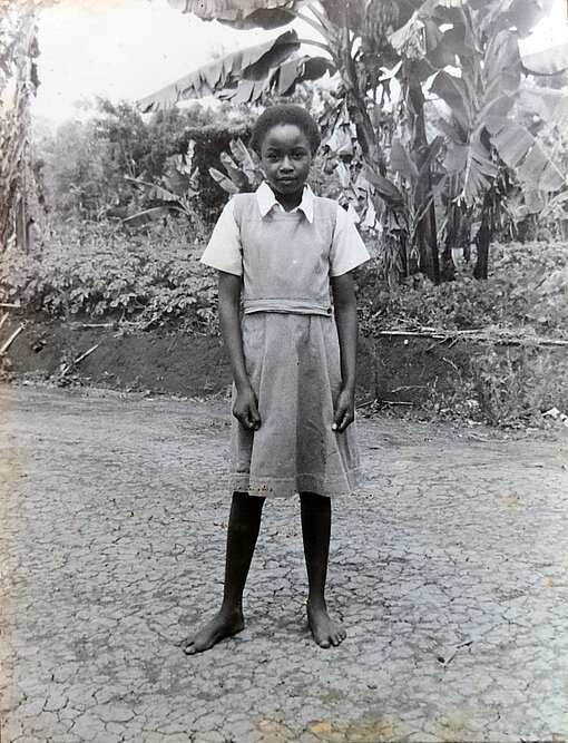 Faith Mbatia war in ihrer Kindheit ein Plan-Patenkind. Schwarz-weiß Bild von Faith als Kind.