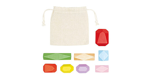 Acht unterschiedlich geformte Stapelsteine in verschiedenen Farben.